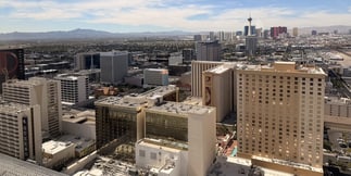 Vegas Strip Cashes In on July Visitors While Downtown Struggles