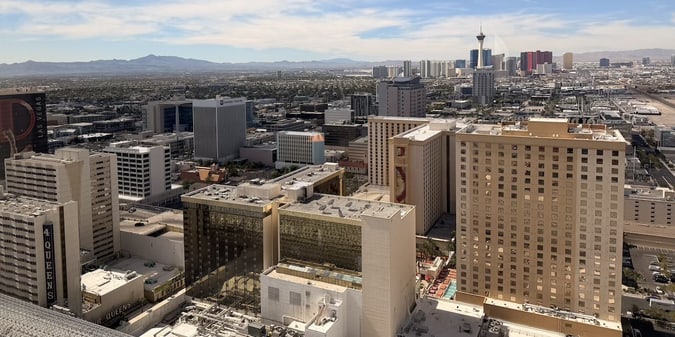 Vegas Strip Cashes In on July Visitors While Downtown Struggles