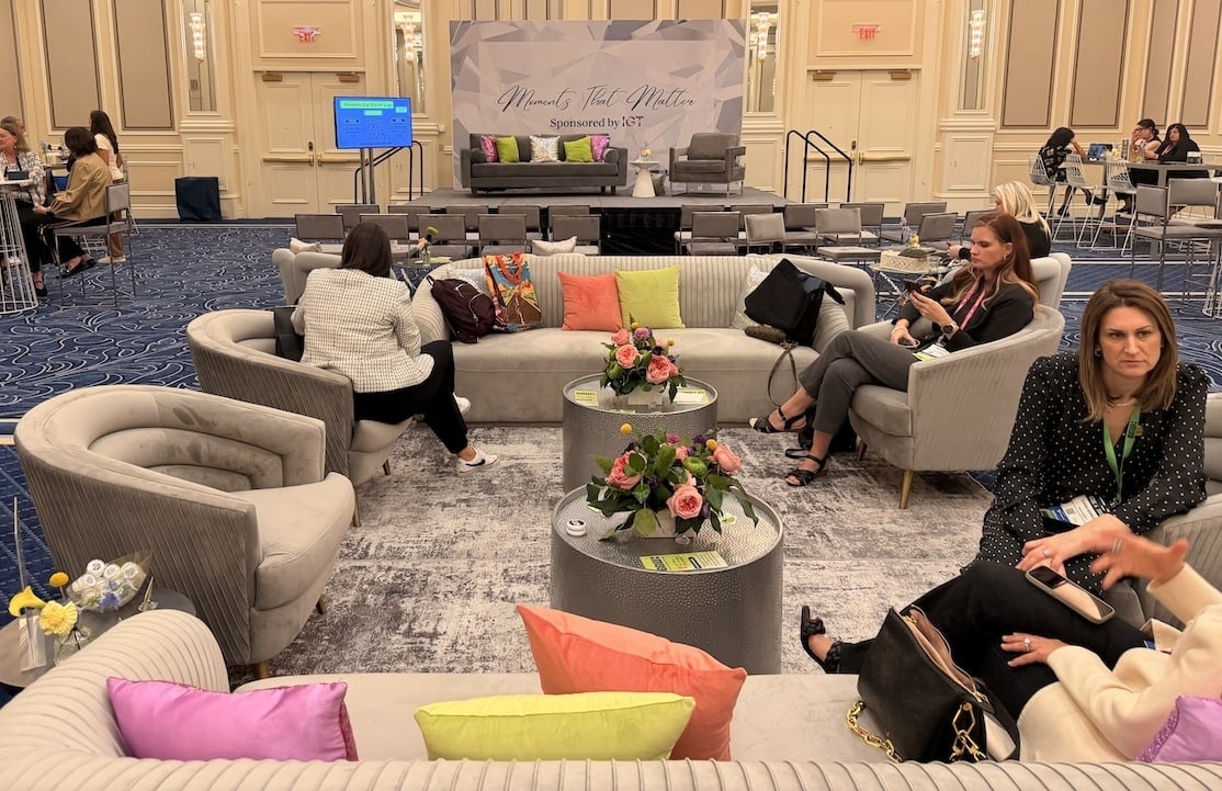 Couches and seating area inside the Global Gaming Women Retreat lounge at G2E