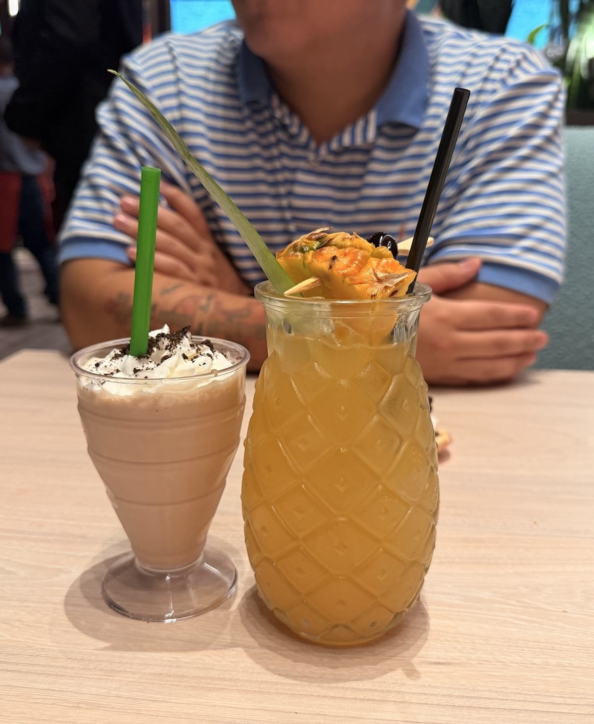 A milkshake next to the Fruity Booty rum cocktail at America restaurant