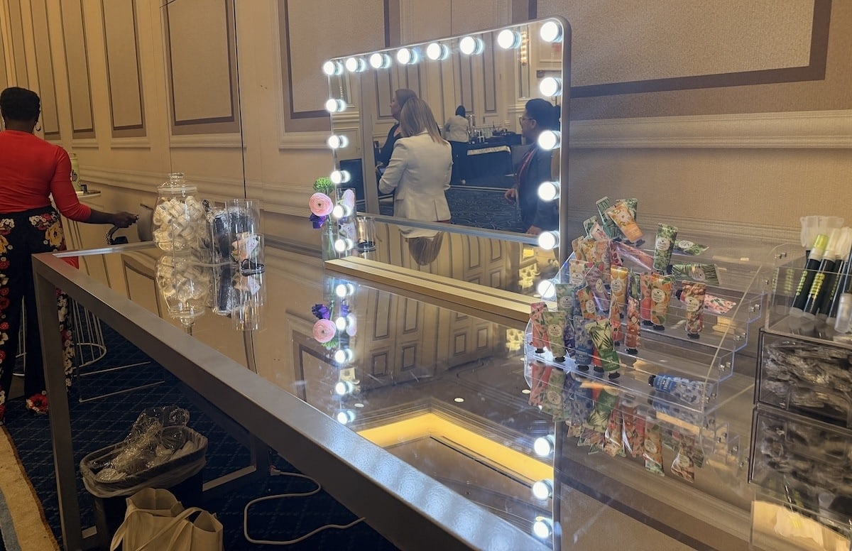 Lighted vanity mirror and touch-up products at the Global Gaming Women Retreat's headshot station