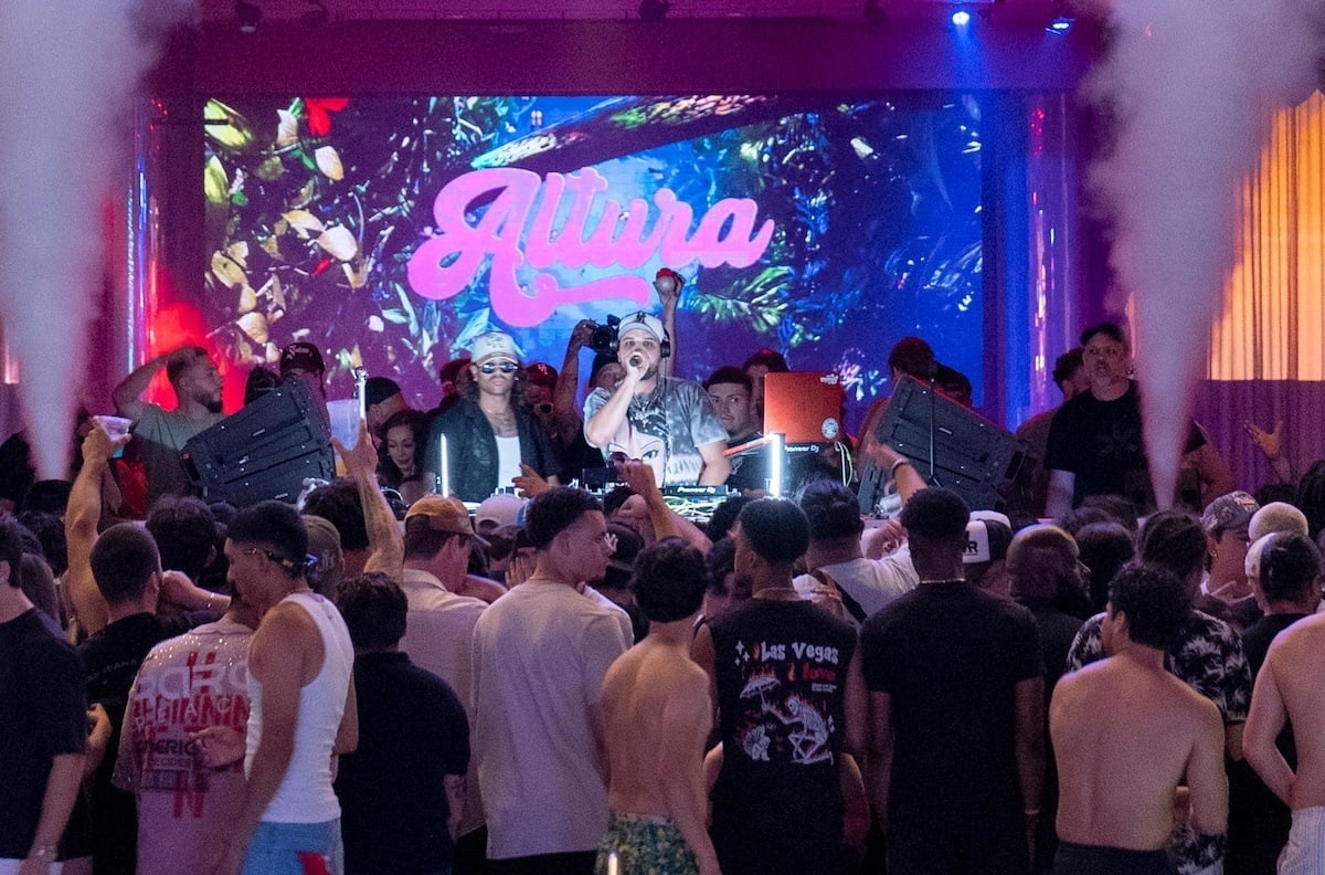 DJ Exile performing at Altura Presents' night swim party at Encore Beach Club