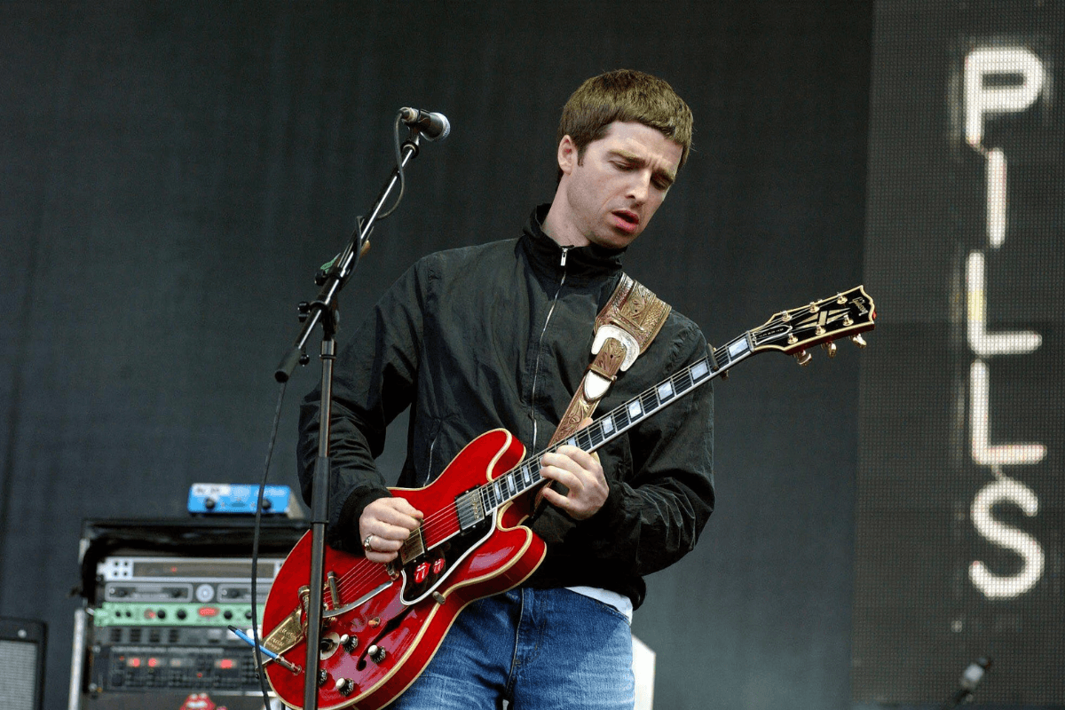 Noel Gallagher playing on stage