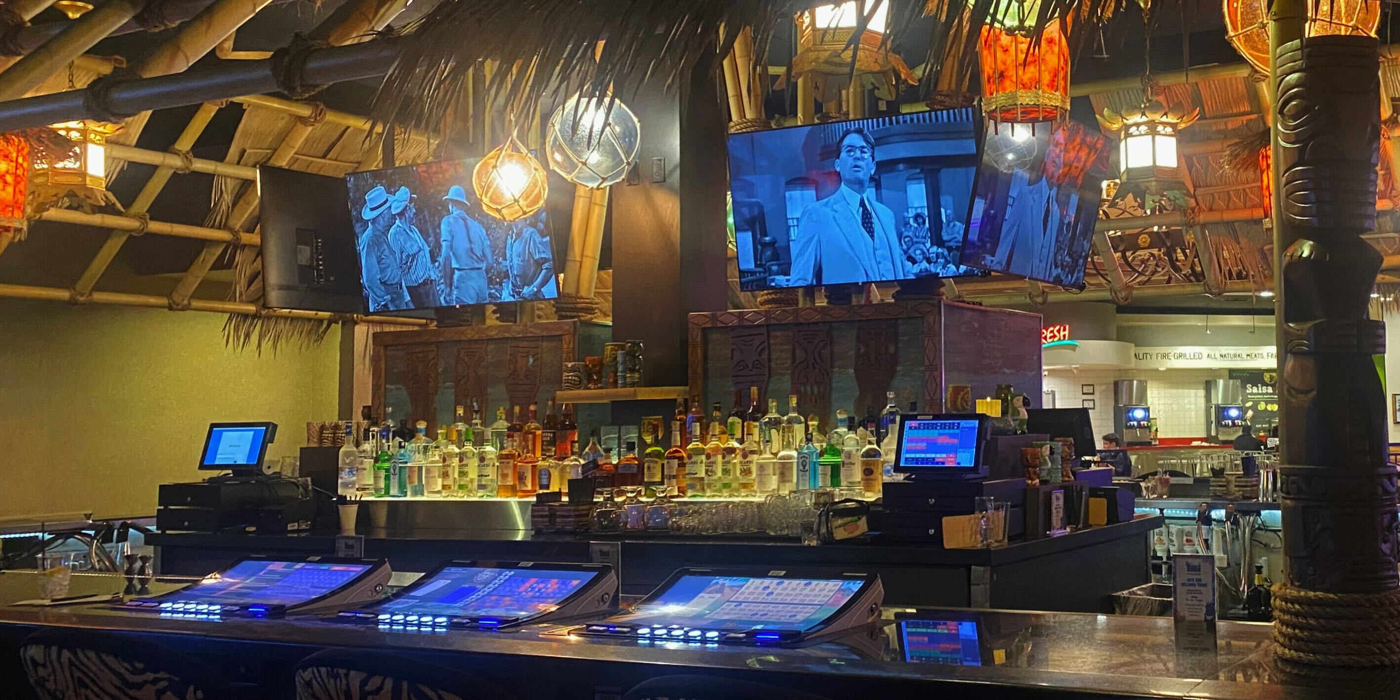 The bartop and TV screens at The Tiki Bar at Excalibur in Las Vegas