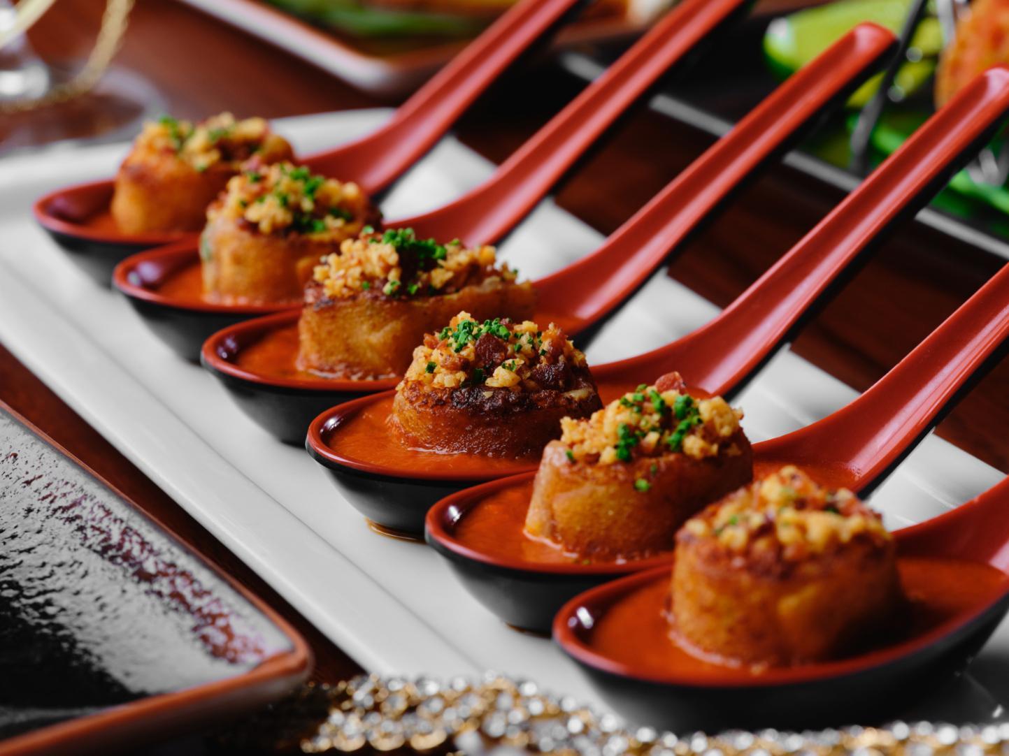 The grilled cheese dumplings in spoons, at Beauty and Essex restaurant