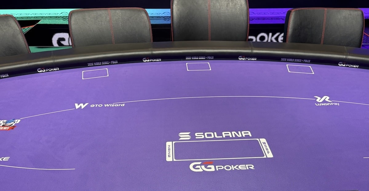 The purple felt on a WSOP poker table and Solana signage.