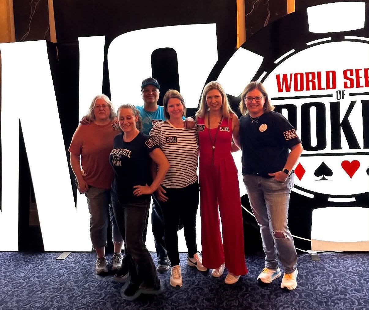 Several women stand in front of the World Series of Poker sign in Las Vegas