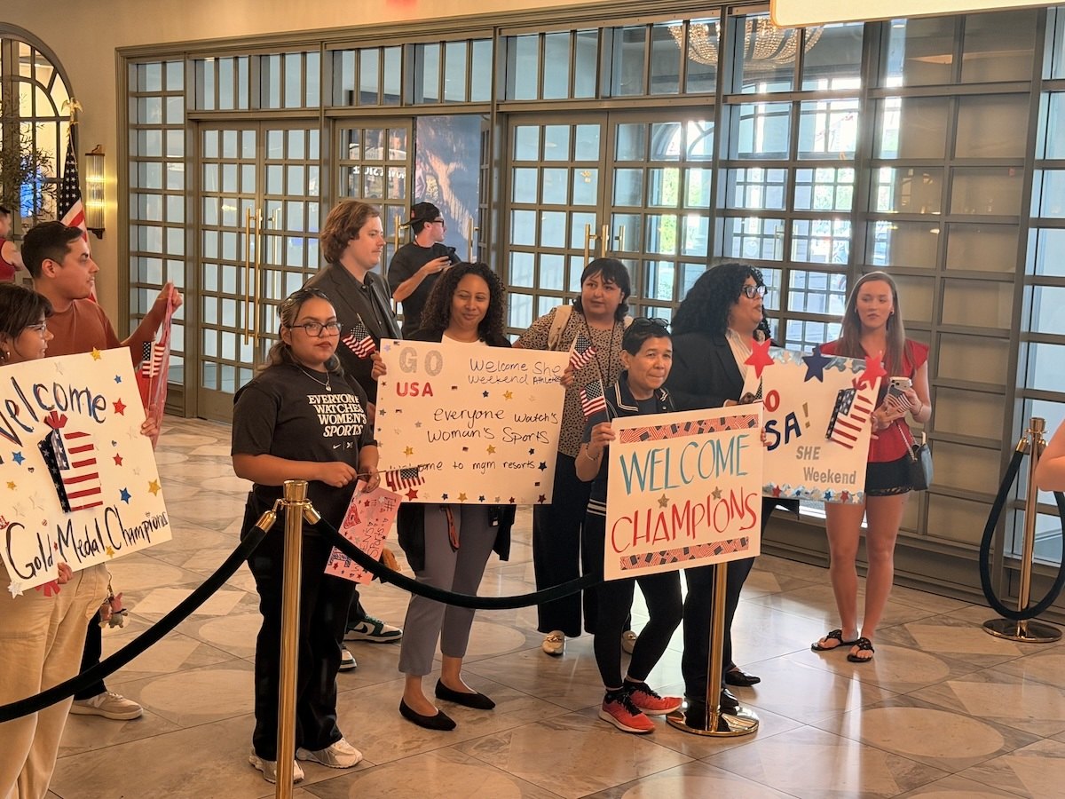 Fans with Team USA signs in Park MGM lobby in Las Vegas