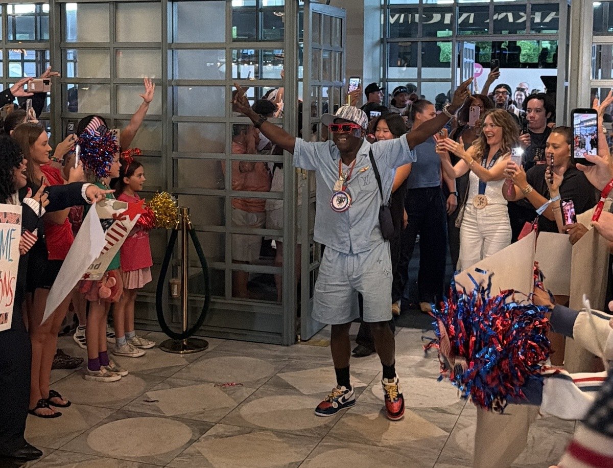Fans with Team USA signs in Park MGM lobby in Las Vegas
