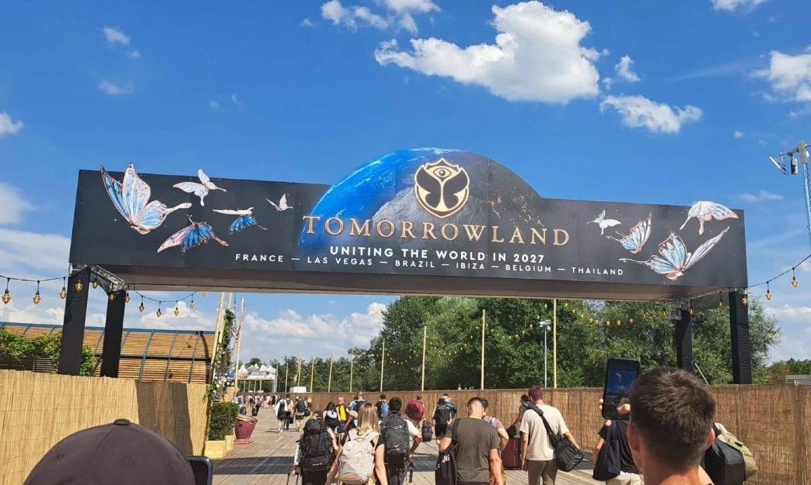 banner at Tomorrowland Festival in Belgium displaying six different destinations for tomorrowland in 2027