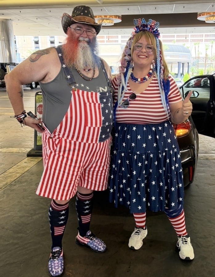 A couple wearing patriotic July 4th gear like American flags at the World Series of Poker
