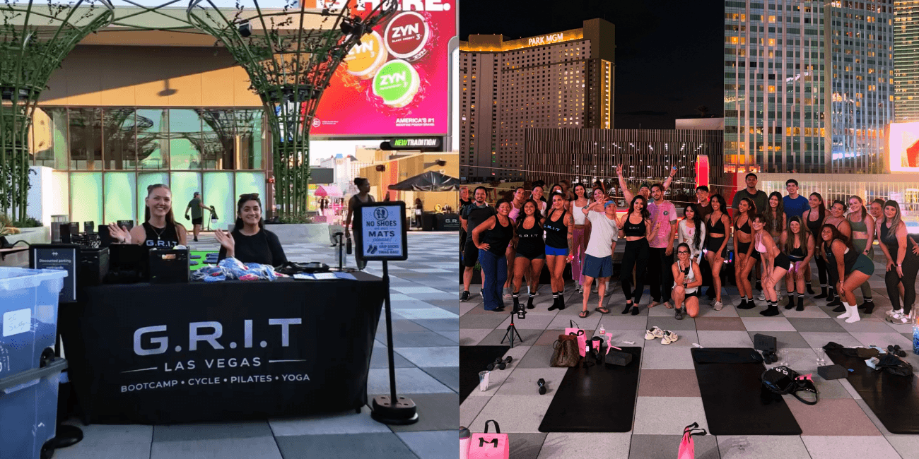 G.R.I.T. instructors greet guests at a merchandise table and a group poses for a photo on the BLVD rooftop overlooking the Las Vegas Strip at night