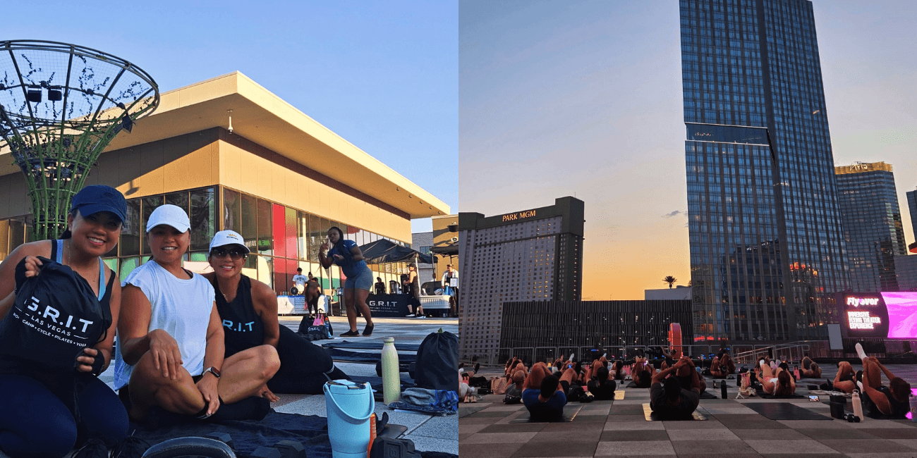 A small group takes a photo on the BLVD rooftop with the Las Vegas Strip skyline glowing at dusk in the background