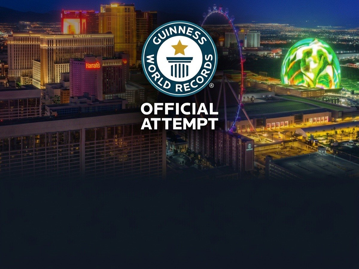 Las Vegas skyline at night with the World Record official attempt seal and Official Attempt wordmark