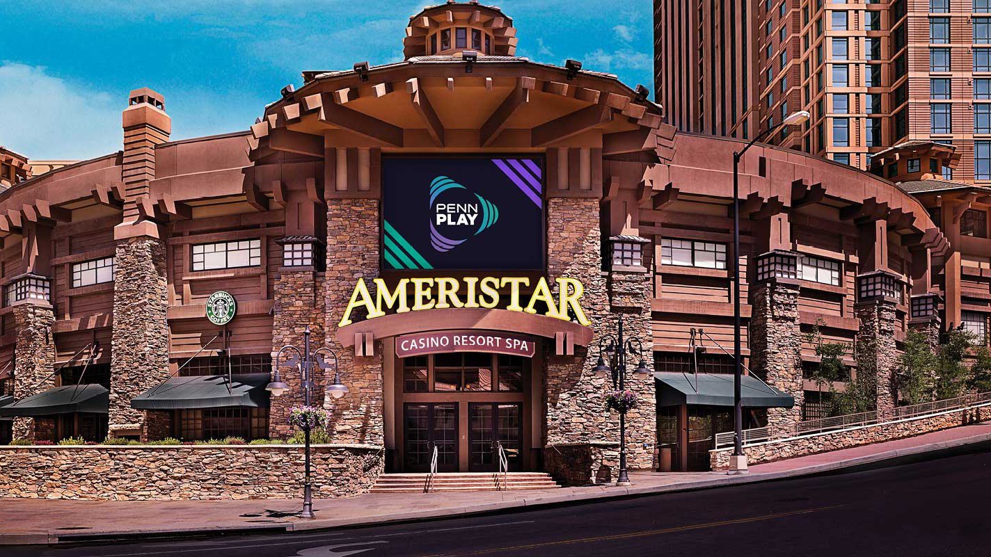 Ameristar Casino Resort Spa exterior entrance featuring Penn Play digital signage and Starbucks, with rustic stone and wood architecture