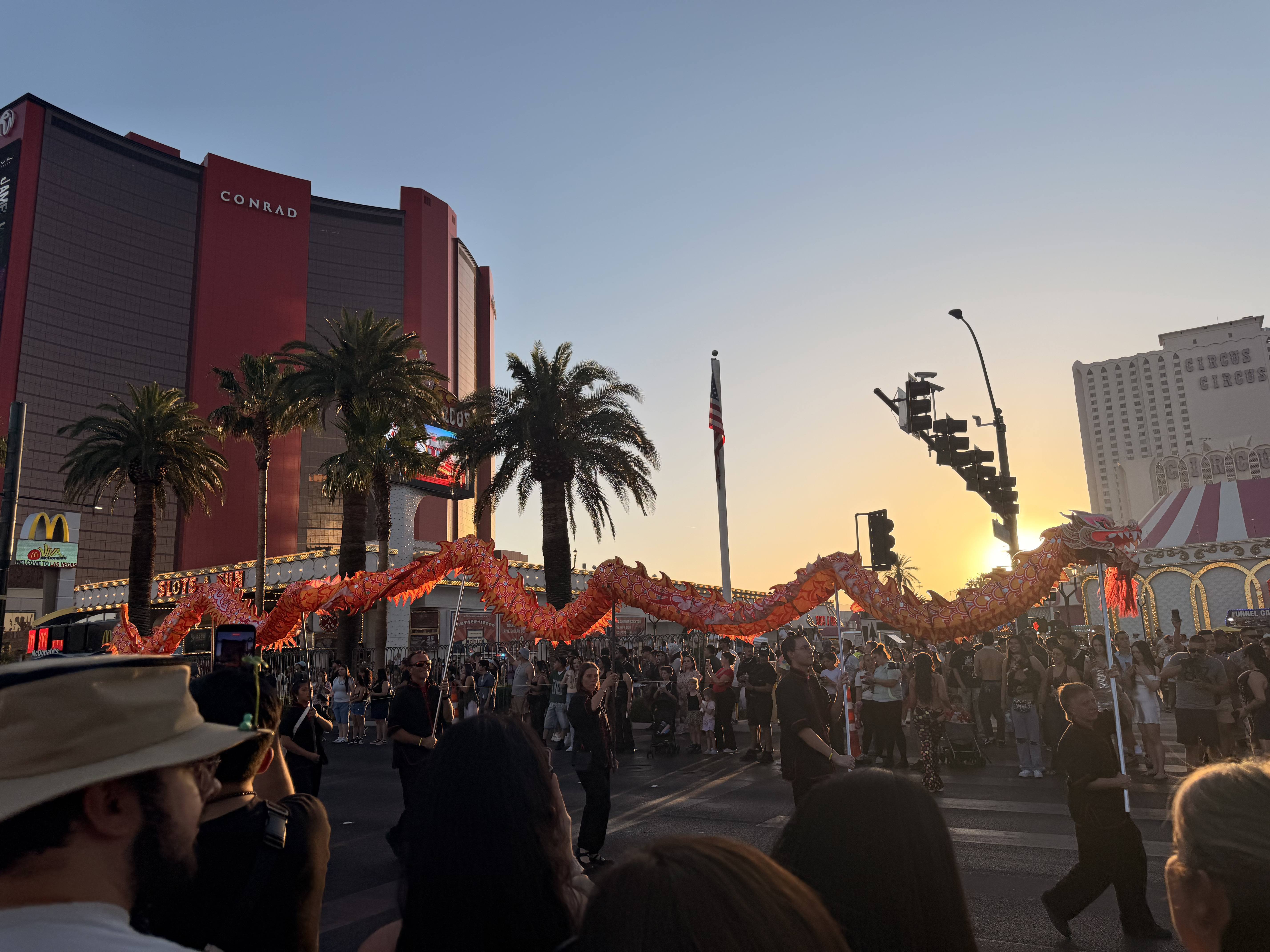 Performers from the Lohan School walk a Chinese dragon display down the Strip in World Party Parade