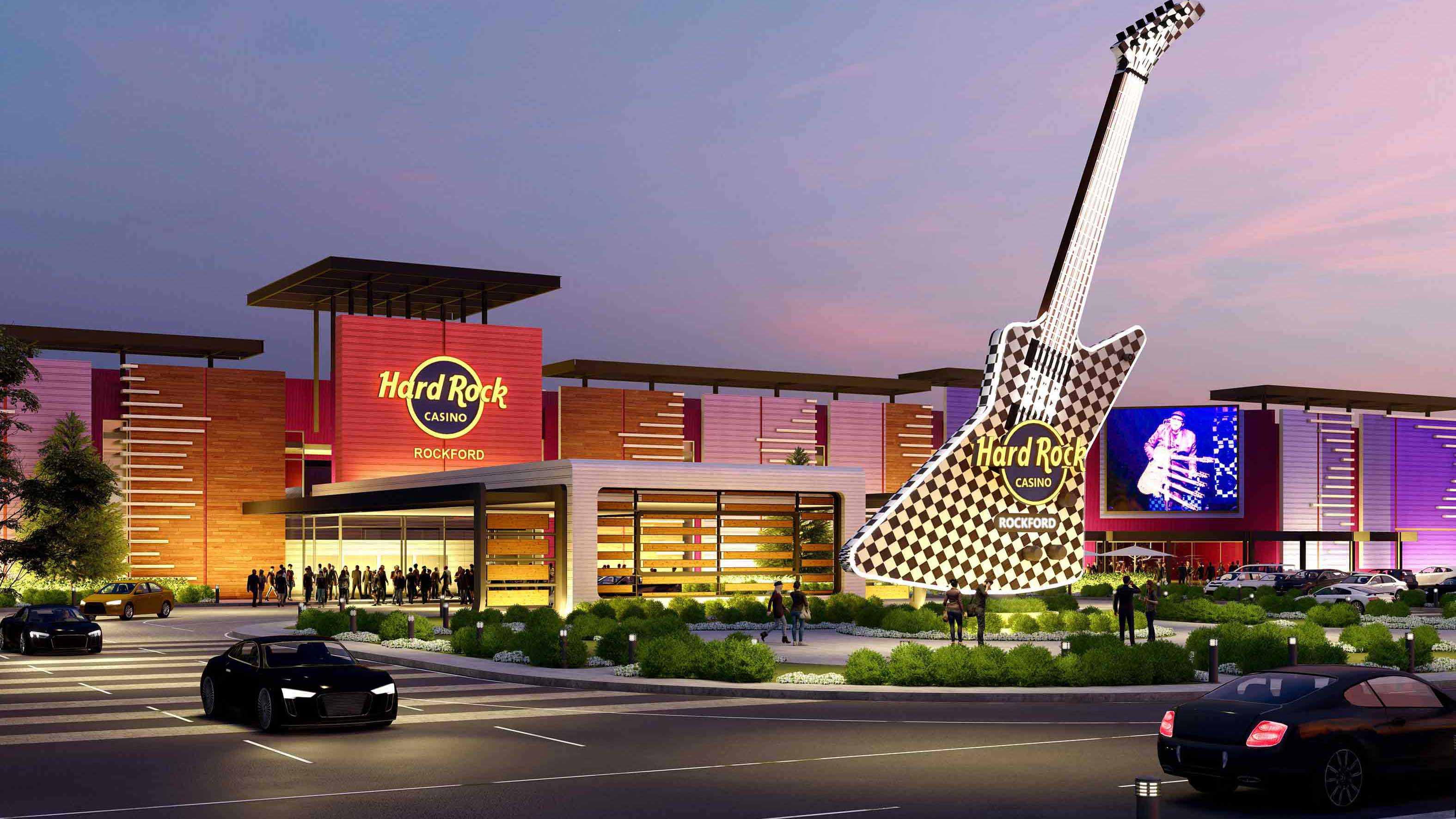 Hard Rock Casino Rockford exterior at dusk featuring a giant checkered guitar sculpture and illuminated signage