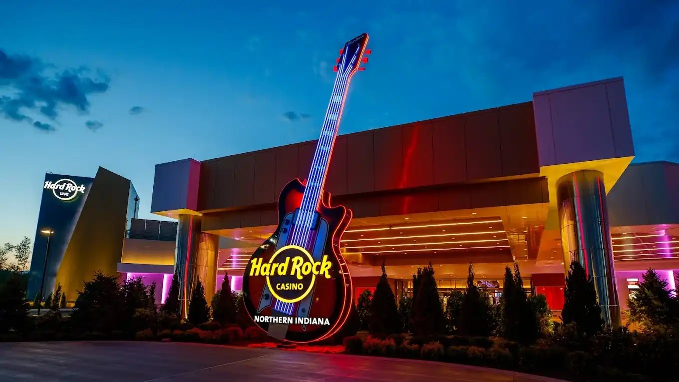 Hard Rock Casino Northern Indiana exterior at night featuring a giant illuminated guitar sign with neon lights