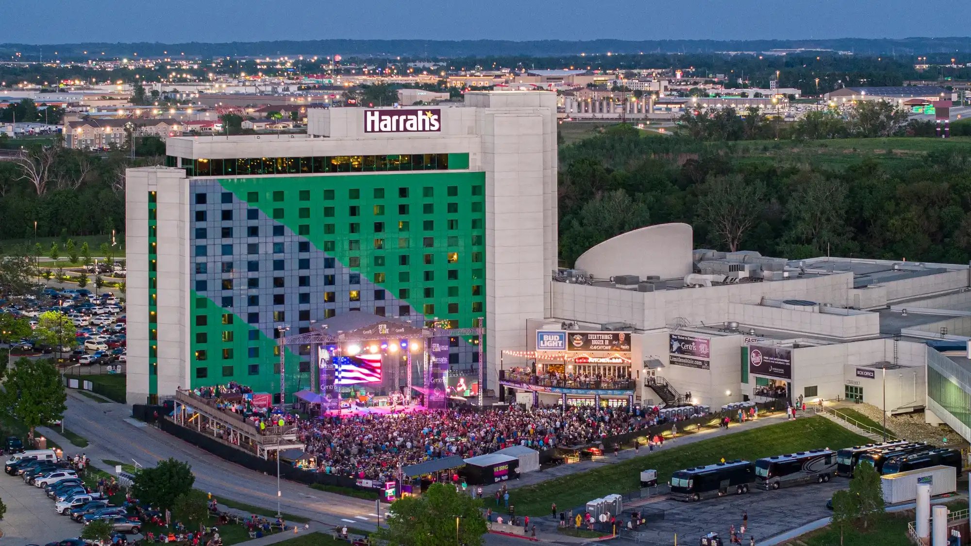 Aerial view of Harrah's Casino outdoor concert with large crowd at night